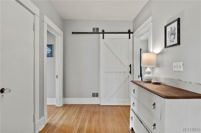 552 Locust St, Lockport-City, NY 14094 - hallway with a barn door and light wood-style floors
