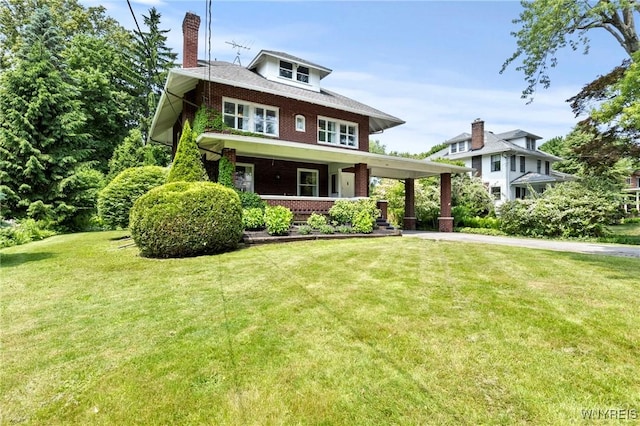 552 Locust St, Lockport-City, NY 14094 - american foursquare style home featuring a porch, brick siding, a front yard, and a chimney