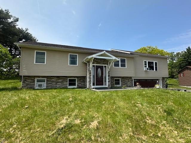 4339 Alexandria Dr, Cortlandville, NY 13045 - raised ranch with a garage and a front yard