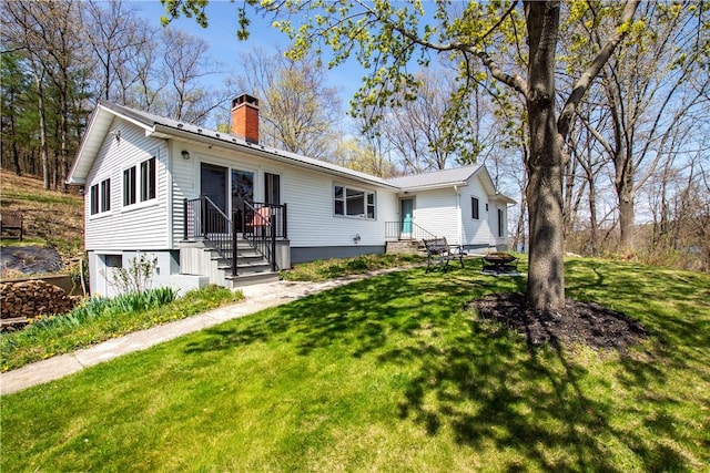 16353 W Lake Rd, Pulteney, NY 14418 - ranch-style home featuring a chimney and a front yard