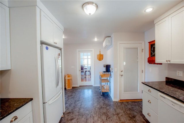 16353 W Lake Rd, Pulteney, NY 14418 - kitchen with white appliances, white cabinetry, dark stone countertops, and recessed lighting