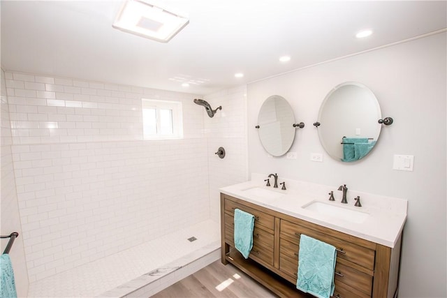 16353 W Lake Rd, Pulteney, NY 14418 - full bath featuring double vanity, a tile shower, wood finished floors, and recessed lighting