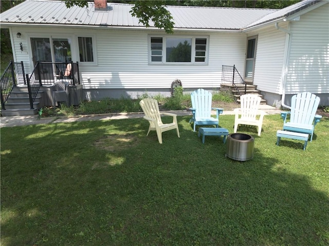 16353 W Lake Rd, Pulteney, NY 14418 - rear view of house featuring a yard and a metal roof