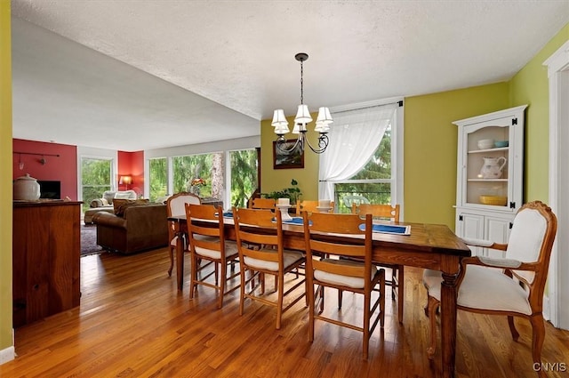 3864 Bristol Rd, Kirkland, NY 13323 - dining space featuring a chandelier and wood finished floors