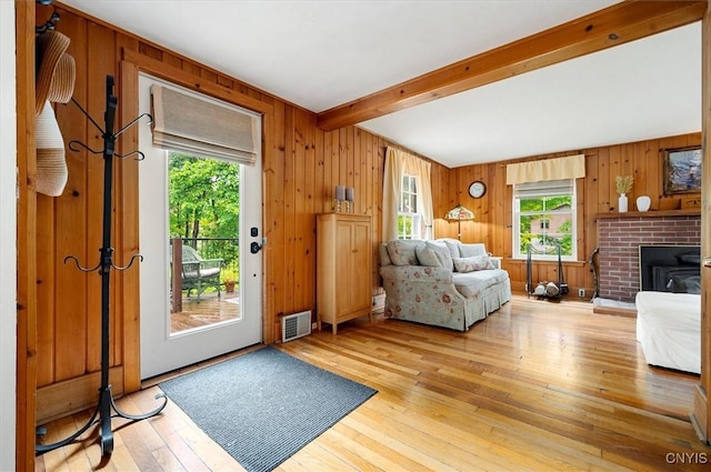 3864 Bristol Rd, Kirkland, NY 13323 - living room with beamed ceiling, light wood-style flooring, and wooden walls