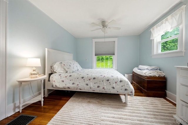 3864 Bristol Rd, Kirkland, NY 13323 - bedroom featuring multiple windows, wood finished floors, and a ceiling fan