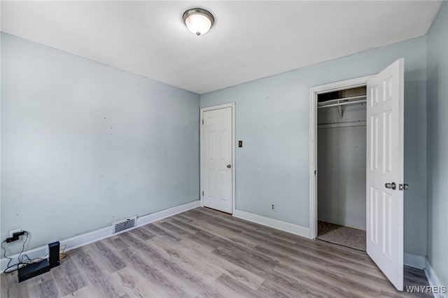 2776 Forest Ave, Niagara Falls, NY 14303 - unfurnished bedroom with wood finished floors and a closet
