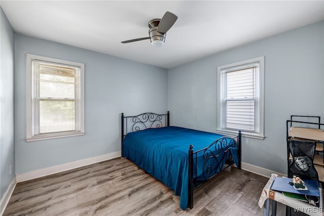 2776 Forest Ave, Niagara Falls, NY 14303 - bedroom featuring multiple windows, wood finished floors, and ceiling fan