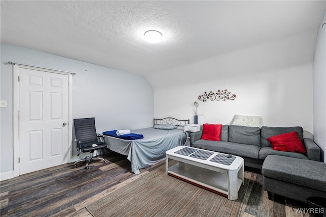 2776 Forest Ave, Niagara Falls, NY 14303 - bedroom featuring wood finished floors, a textured ceiling, and lofted ceiling