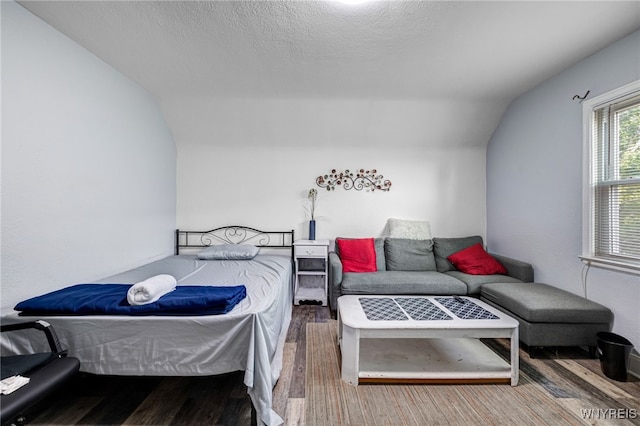 2776 Forest Ave, Niagara Falls, NY 14303 - bedroom featuring vaulted ceiling, wood finished floors, and a textured ceiling