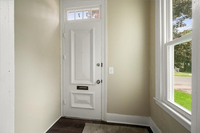37 Nelson St, Auburn, NY 13021 - doorway featuring baseboards and dark wood-style flooring