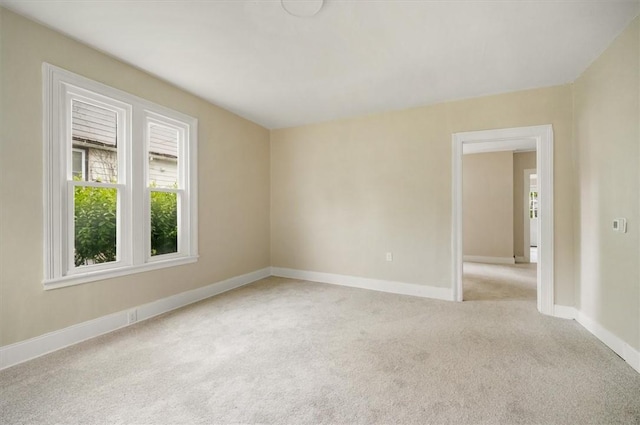 37 Nelson St, Auburn, NY 13021 - empty room with light carpet and baseboards