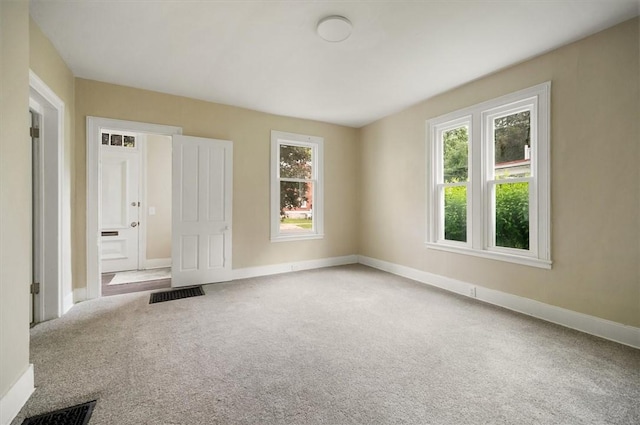 37 Nelson St, Auburn, NY 13021 - unfurnished bedroom featuring multiple windows and carpet floors