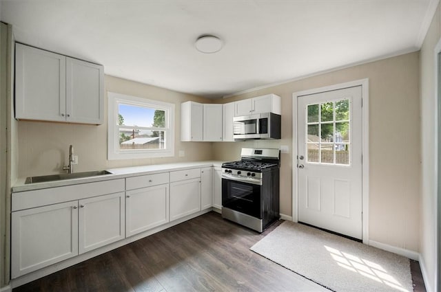 37 Nelson St, Auburn, NY 13021 - kitchen with stainless steel appliances, white cabinets, dark wood-style floors, and light countertops
