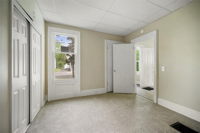 37 Nelson St, Auburn, NY 13021 - unfurnished bedroom featuring a paneled ceiling, carpet, and a closet