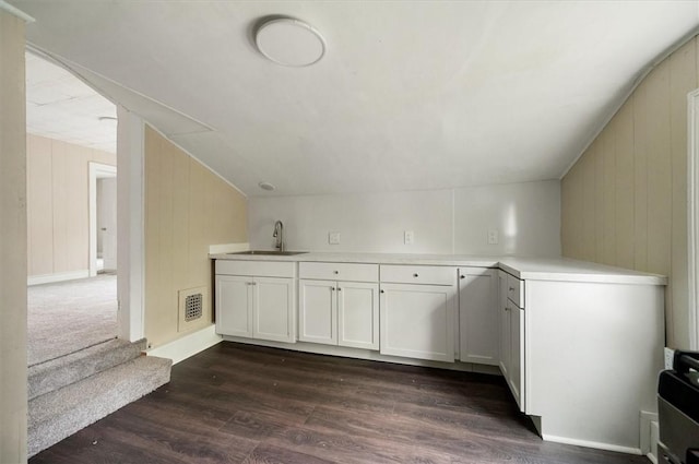 37 Nelson St, Auburn, NY 13021 - bar area featuring lofted ceiling, dark wood-style flooring, and wooden walls