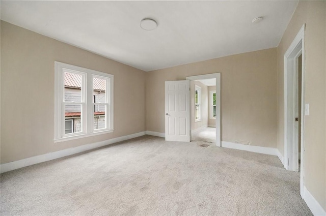 37 Nelson St, Auburn, NY 13021 - carpeted empty room with baseboards and a smoke detector