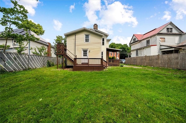37 Nelson St, Auburn, NY 13021 - rear view of property with a chimney, a fenced backyard, and a wooden deck