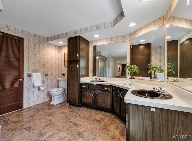 44 Deer Run, Amherst, NY 14221 - bathroom with double vanity and wallpapered walls