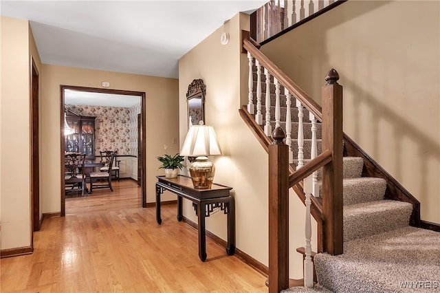 44 Deer Run, Amherst, NY 14221 - staircase with wood finished floors and wallpapered walls