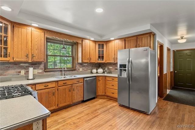 8345 Lapp Rd, Clarence, NY 14051 - kitchen featuring stainless steel appliances, light wood-type flooring, light countertops, brown cabinets, and recessed lighting