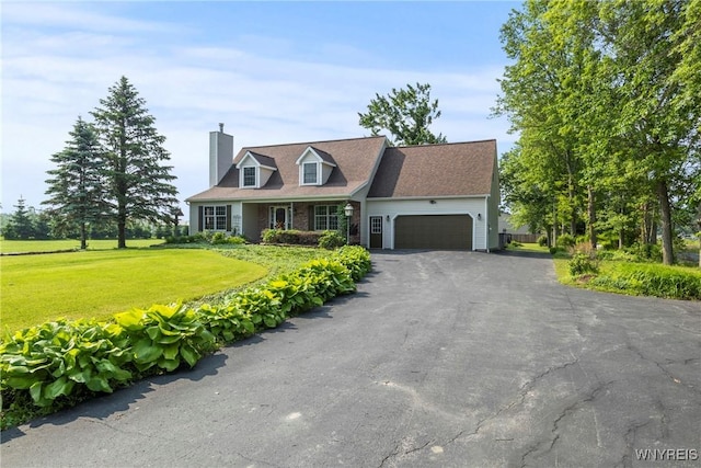 8345 Lapp Rd, Clarence, NY 14051 - cape cod house featuring an attached garage, asphalt driveway, a front yard, and a chimney