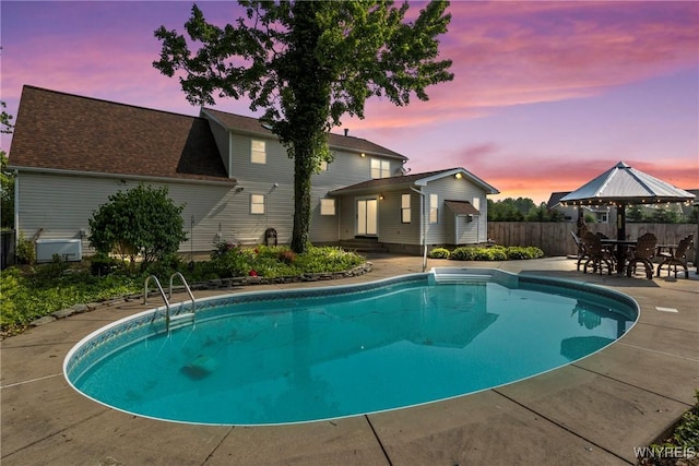 8345 Lapp Rd, Clarence, NY 14051 - pool at dusk featuring a patio area
