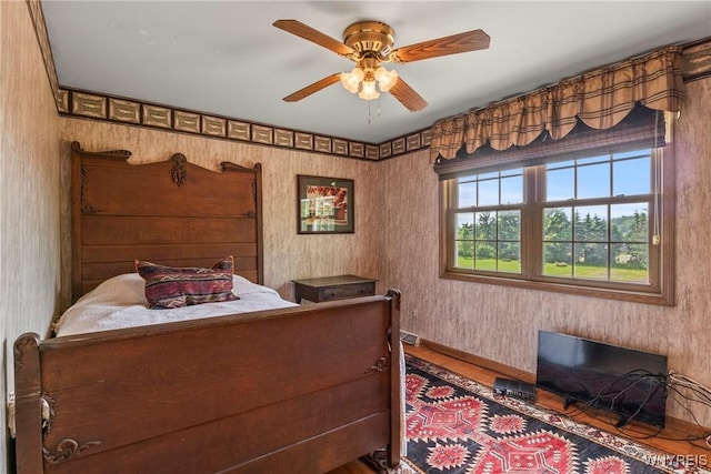 8345 Lapp Rd, Clarence, NY 14051 - bedroom with wood finished floors and ceiling fan
