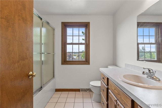 8345 Lapp Rd, Clarence, NY 14051 - full bath featuring vanity, tile patterned floors, and combined bath / shower with glass door