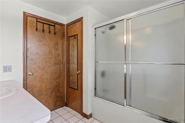 8345 Lapp Rd, Clarence, NY 14051 - bathroom featuring combined bath / shower with glass door, tile patterned flooring, and vanity