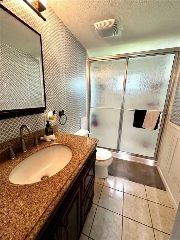 22 Orchard Rd, Greece, NY 14612 - full bath featuring vanity, a shower with door, tile patterned floors, and a textured ceiling