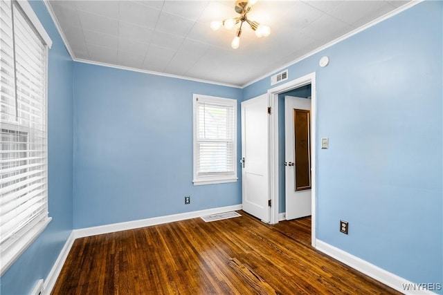 55 Spruce Rd, Amherst, NY 14226 - spare room with dark wood-style flooring, crown molding, a chandelier, and a baseboard heating unit