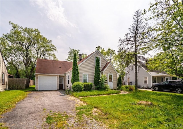 55 Spruce Rd, Amherst, NY 14226 - view of front of home featuring a garage, driveway, and a chimney