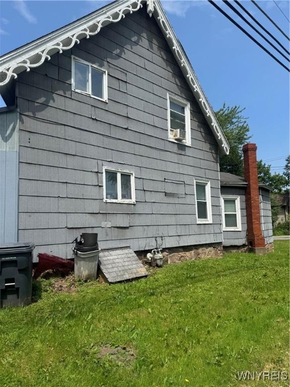 38 N Main St, Royalton, NY 14105 - view of home's exterior featuring a lawn