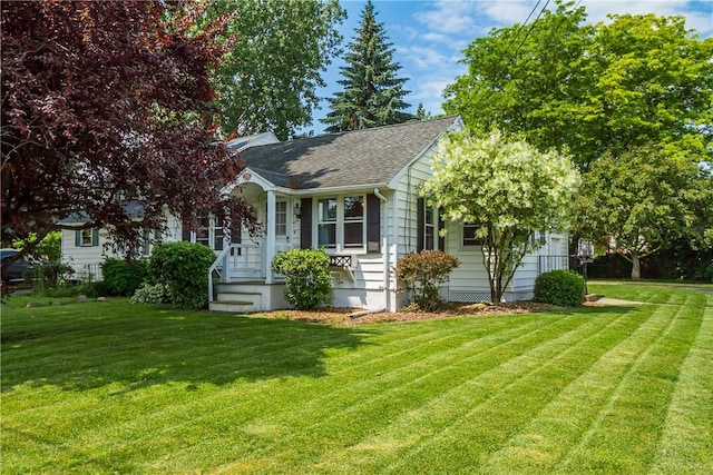 19 Rahway Rd, Gates, NY 14606 - view of front of property with a front lawn and a shingled roof