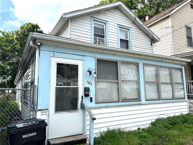 163 Court St, Syracuse, NY 13208 - view of front facade with entry steps and a sunroom