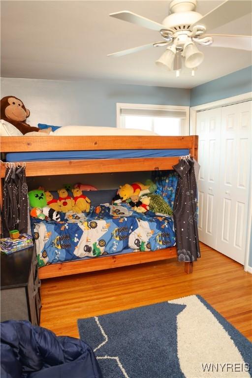 1422 Master St, North Tonawanda, NY 14120 - bedroom with wood finished floors, a ceiling fan, and a closet