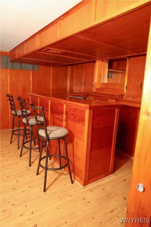 1422 Master St, North Tonawanda, NY 14120 - indoor dry bar featuring light wood finished floors and wooden walls