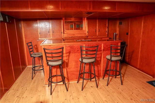 1422 Master St, North Tonawanda, NY 14120 - indoor wet bar with light wood finished floors and wood walls