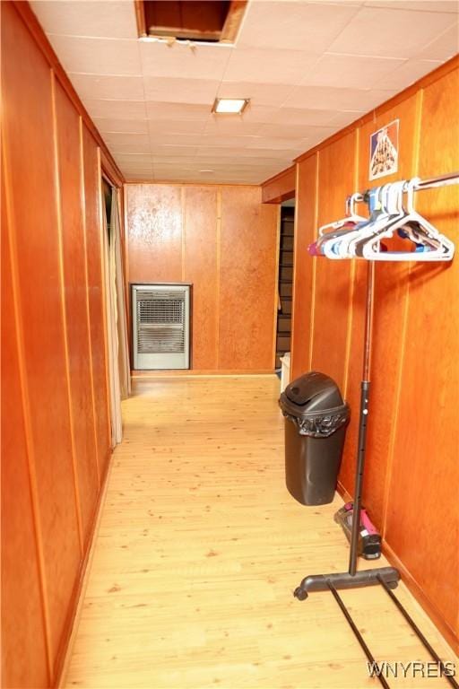 1422 Master St, North Tonawanda, NY 14120 - corridor featuring heating unit, wood finished floors, and wooden walls