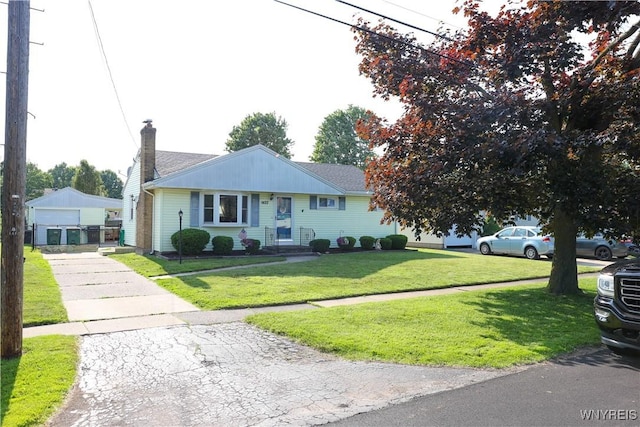 1422 Master St, North Tonawanda, NY 14120 - bungalow-style home featuring a garage, a front lawn, driveway, and a chimney