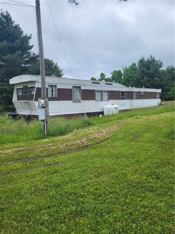 9824 County Route 114th Rd Unit 2, Wayne, NY 14840 - rear view of property featuring a lawn