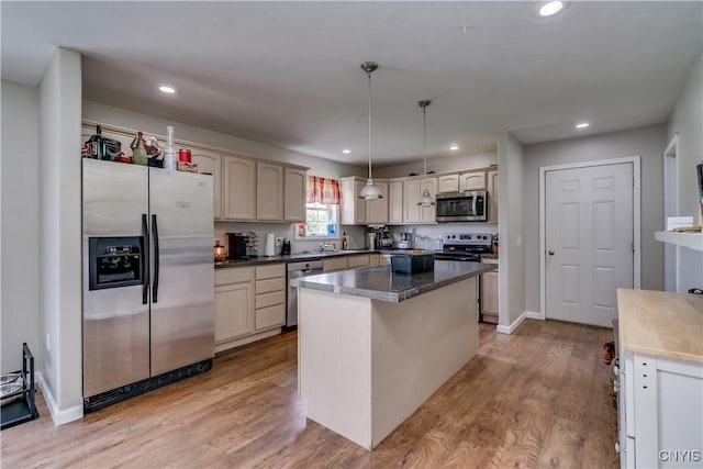 30656 Nys Route 37, Le Ray, NY 13637 - kitchen with stainless steel appliances, recessed lighting, light wood-style flooring, a center island, and pendant lighting