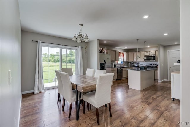 30656 Nys Route 37, Le Ray, NY 13637 - dining space featuring healthy amount of natural light, a chandelier, recessed lighting, and dark wood-type flooring