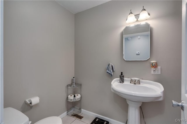 30656 Nys Route 37, Le Ray, NY 13637 - half bath featuring toilet and tile patterned flooring
