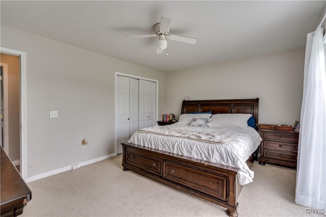 30656 Nys Route 37, Le Ray, NY 13637 - bedroom with light colored carpet, a closet, and a ceiling fan