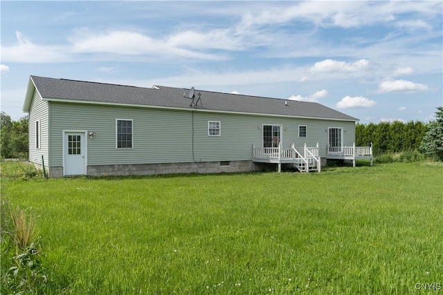 30656 Nys Route 37, Le Ray, NY 13637 - rear view of house featuring a wooden deck and a lawn