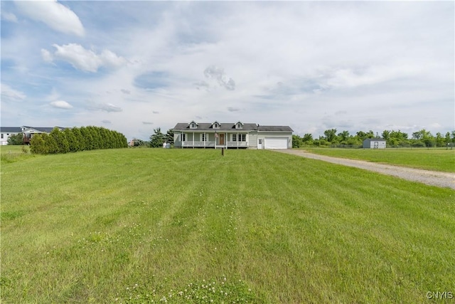 30656 Nys Route 37, Le Ray, NY 13637 - view of front of property featuring driveway, an attached garage, and a front yard