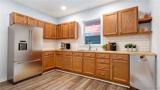 63 Briggs Ave, Buffalo, NY 14207 - kitchen featuring stainless steel fridge, dishwasher, open shelves, light wood finished floors, and tasteful backsplash