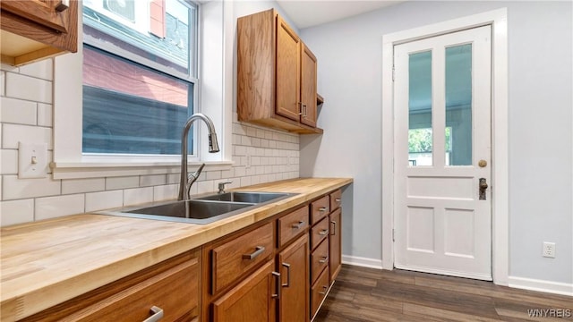 63 Briggs Ave, Buffalo, NY 14207 - kitchen featuring butcher block counters, backsplash, brown cabinets, and healthy amount of natural light